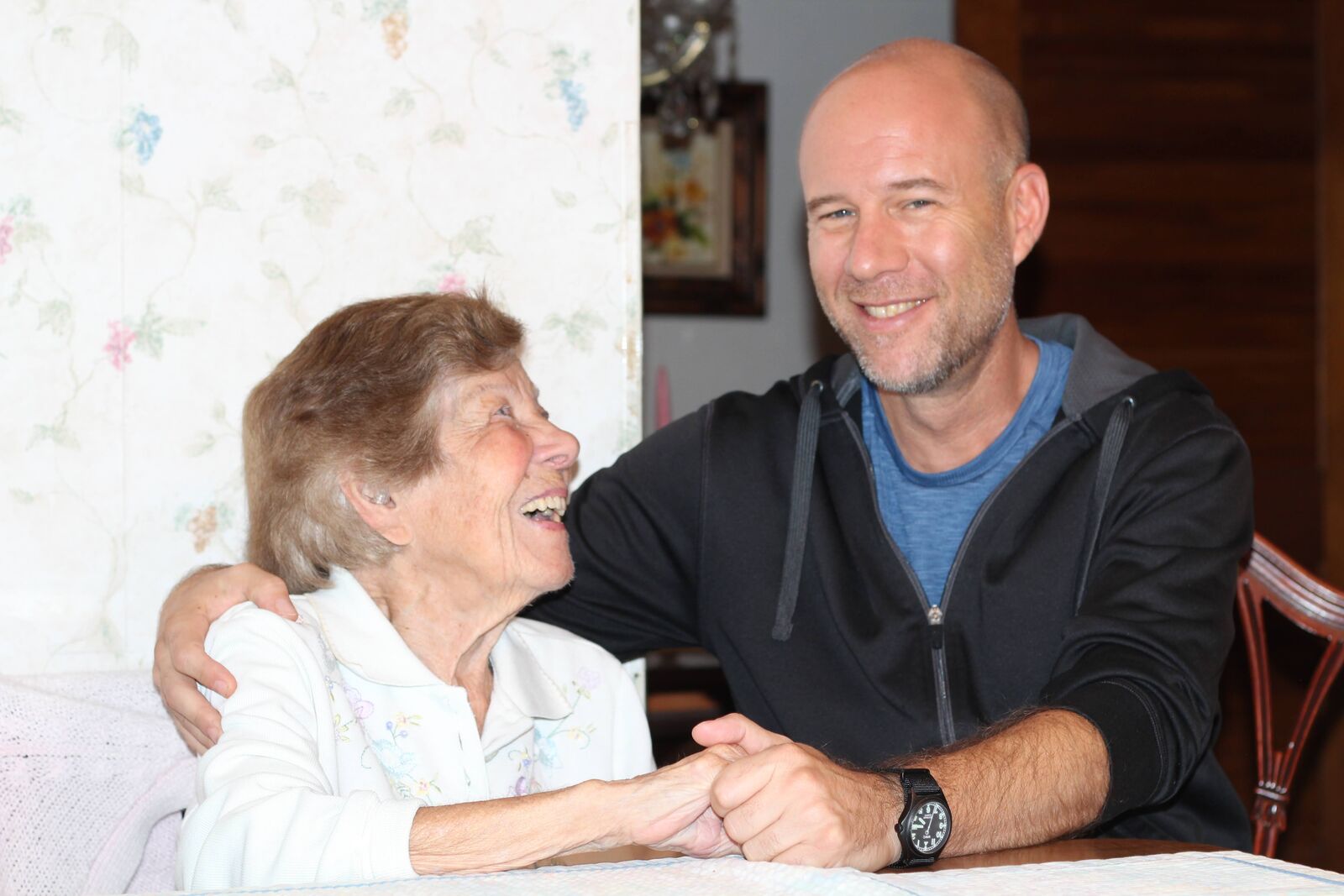 Clara and grandson at the kitchen table